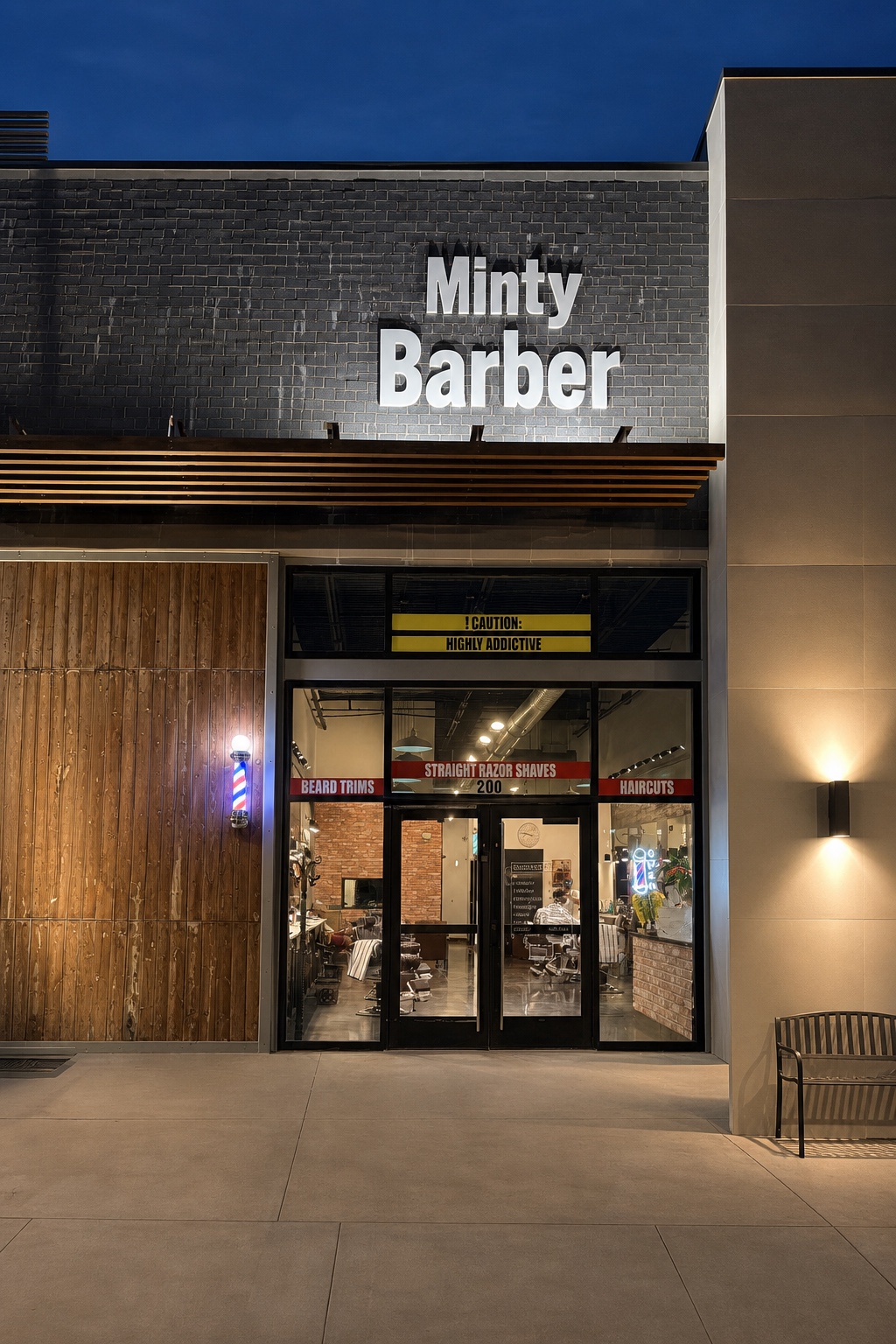 Minty Barber storefront glowing beneath the evening sky