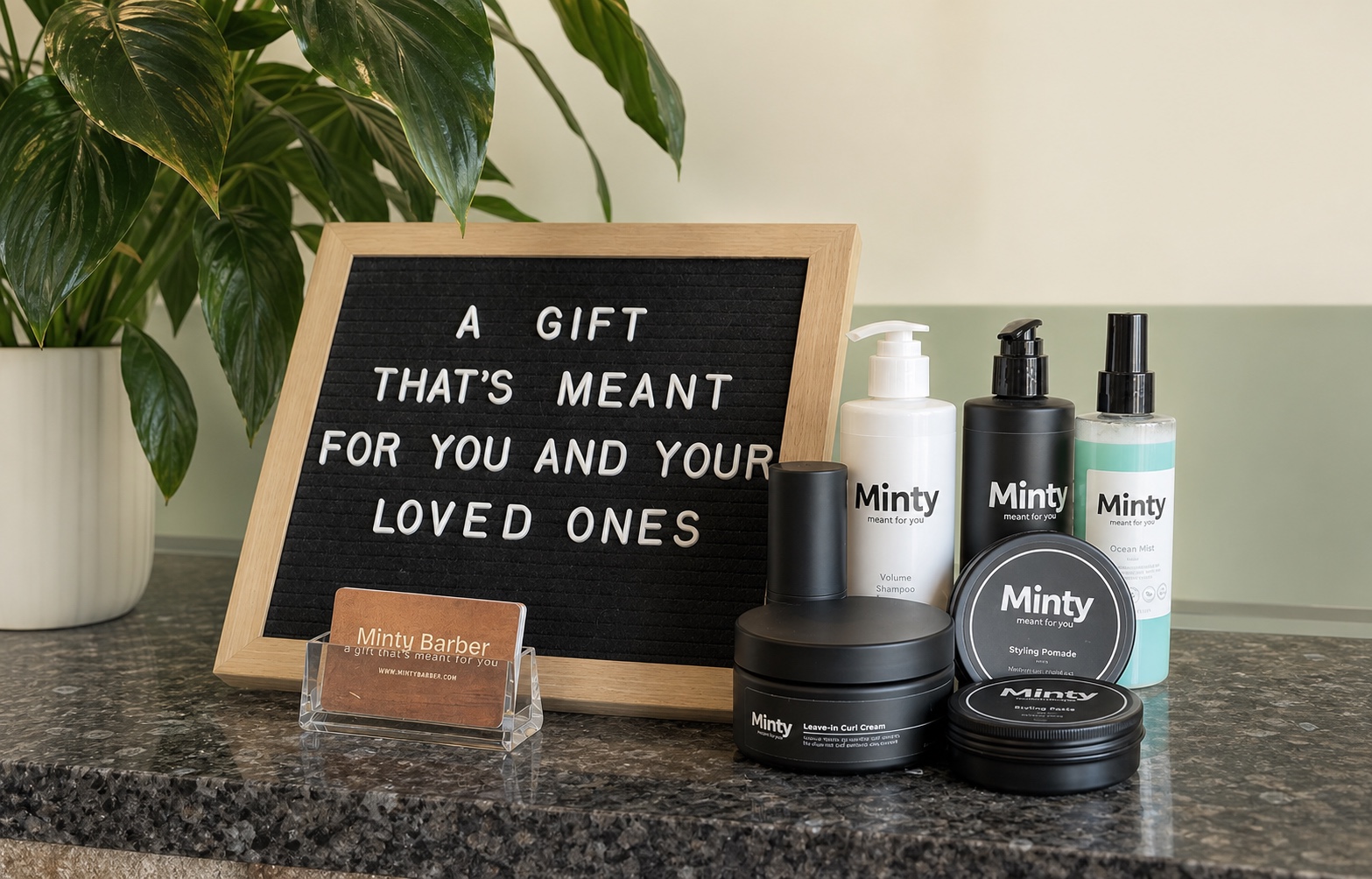 Minty hair and grooming products displayed beside a gift message at a Minty Barber shop